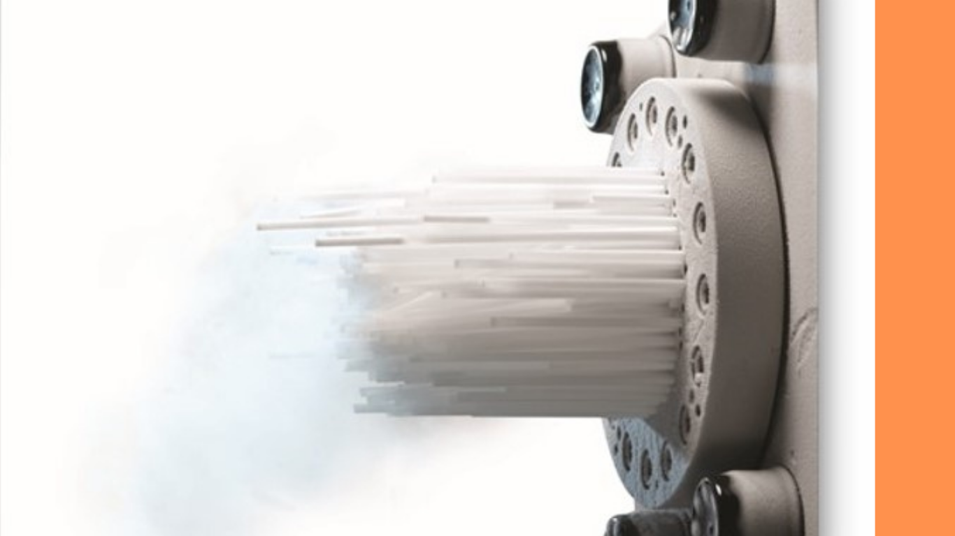 High-density dry ice pellets extruding from the pelletizer die head with CO₂ vapor at the face